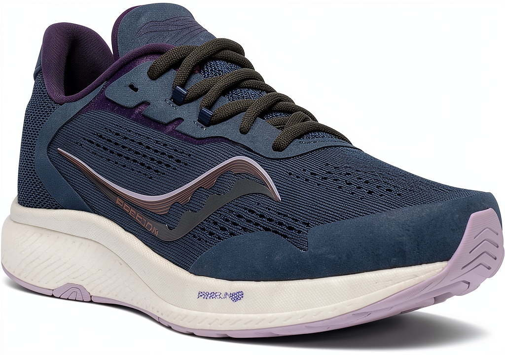 Saucony womens running shoes in Powder/Jade color on a running track